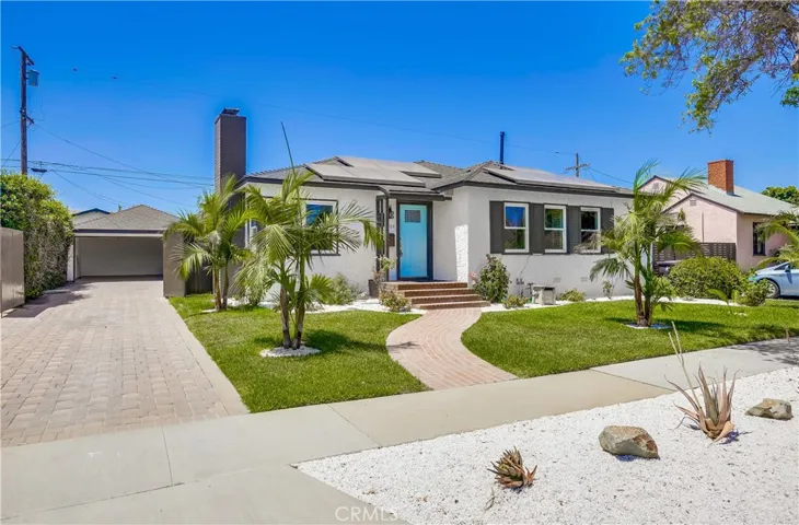Welcome Home to 4529 Walnut Avenue in Bixby Knolls! This long driveway with attractive pavers leading to the 2-car garage offers potential for RV parking.