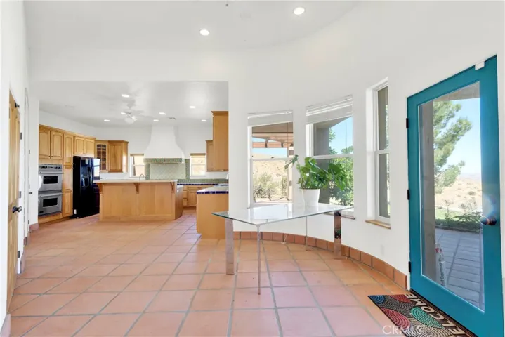 Kitchen dining and door leading to backyard