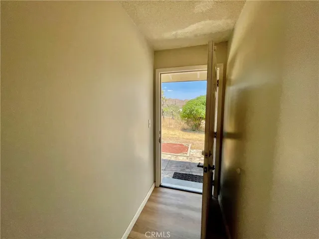 Additional exterior door with doggie door to side yard.
