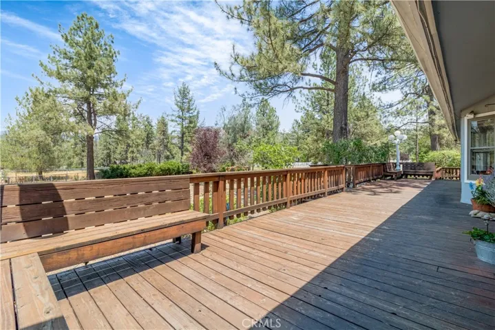 Large view deck off the main entrance to the home, overlooking the grounds to the north through the pine studded property to the mountains surrounding Idyllwild