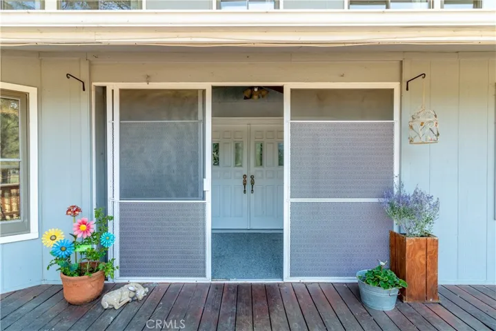 Screened in area leading to the primary entrance, leading into the lovely inside formal entry