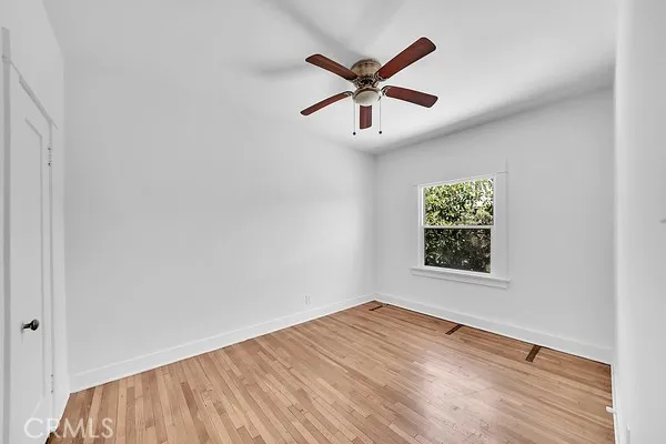 Bedroom with Window and Ceiling Fan