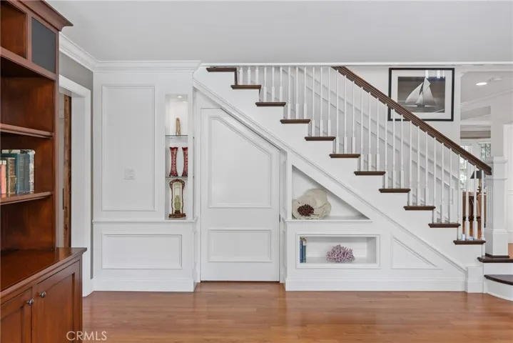 Impeccable craftsmanship on display in the grand staircase. There is also a hidden door that currently serves as a pantry.  How cool is that!