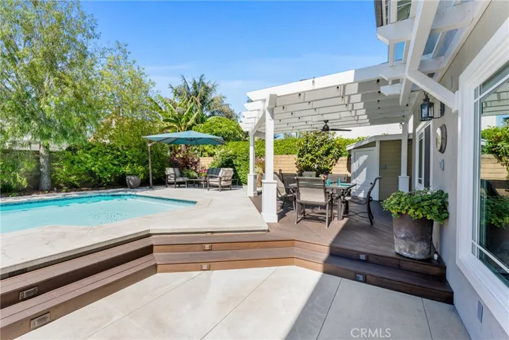 Relax and unwind in the private backyard pool.
