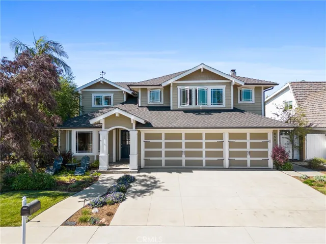This is a gorgeous beach close, interior tract pool home with a custom modern craftsman style!