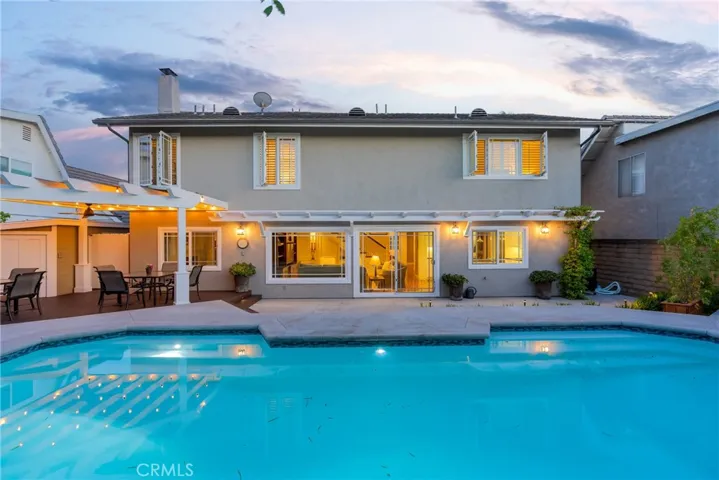 Step outside to the entertainer's backyard with a pristine pool.
