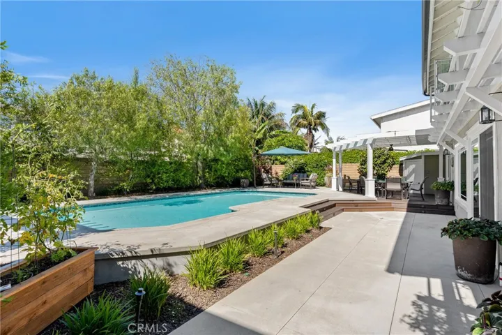 Lush low maintenance landscaping creates a private oasis.