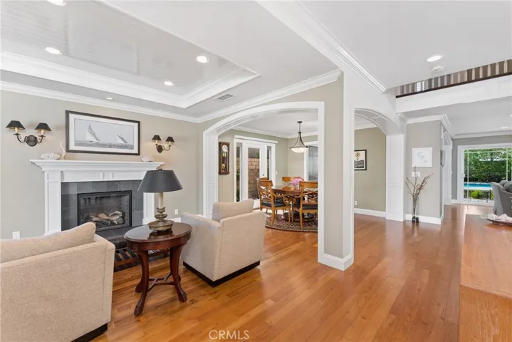 Step inside to an open and spacious floor plan with a gas fireplace and sitting area upon entering the home.