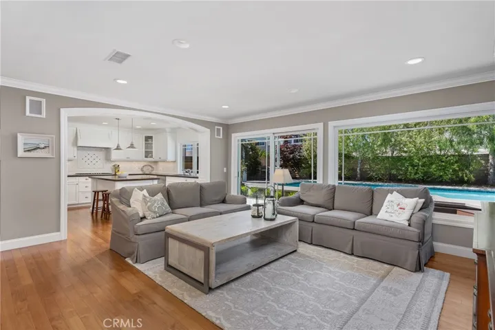Family room is open to the kitchen.  Great natural light from large windows overlooking the private backyard