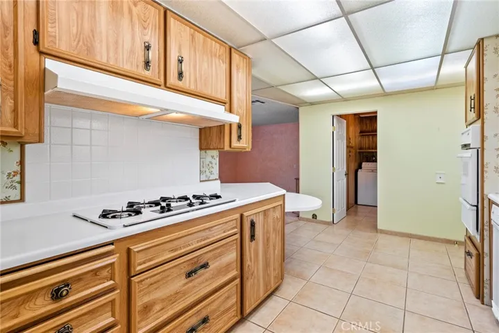 Abundant cabinetry and extensive counterspace makes cooking and baking a delight.