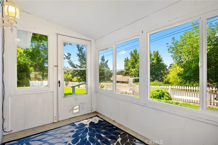 There is an enclosed front porch which allows you to enjoy your front yard any time of year.