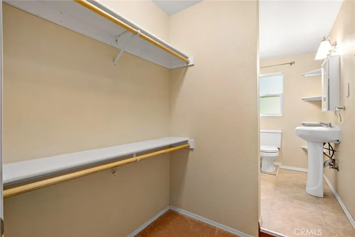 Past the living area we find the bathroom with closet area.