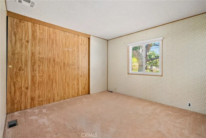 Bedroom 2 overlooks the backyard and has a large closet.