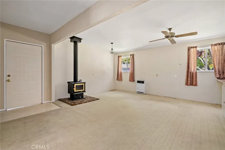 The living area features a wood burning stove plus an AC unit!