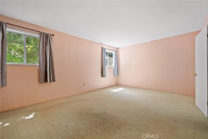 The bedroom of the apartment is very spacious and bright.