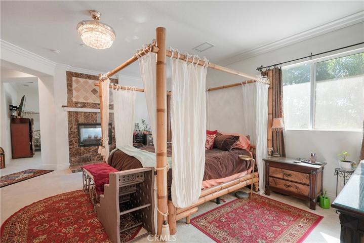 Huge master bedroom, with high ceilings with view to master retreat and master side fireplace