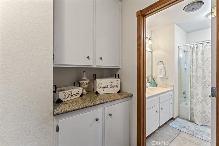 The guest bath is conveniently located near the guest bedroom and entertainment area.