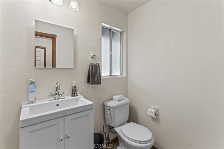 adjacent powder room, just off garage direct entry
