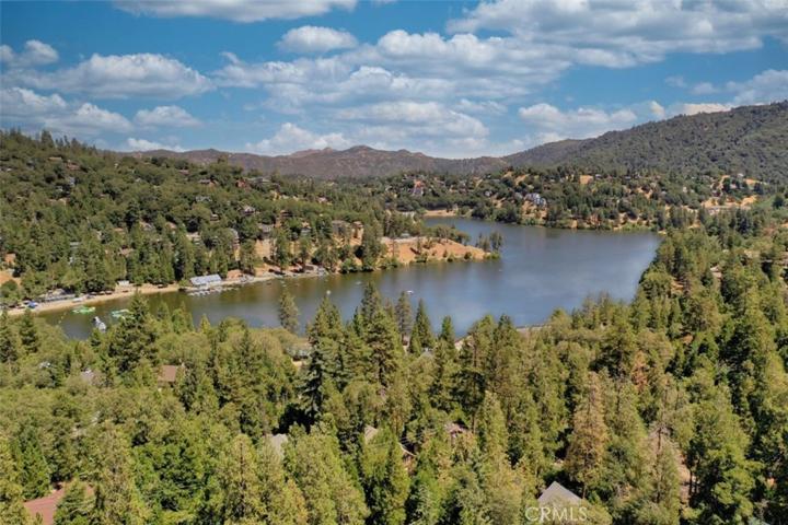 Walk here in just a few minutes . . .keep the privacy or trim a few trees (on your own property) for a nice lake view!