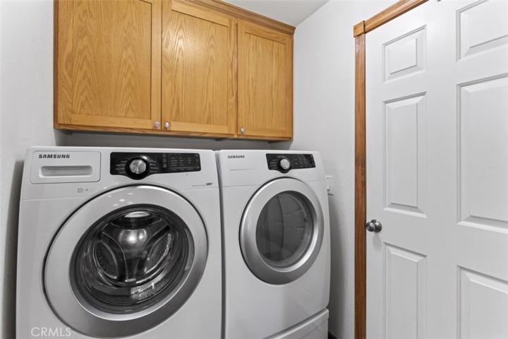 Laundry room with front load washer/dryer