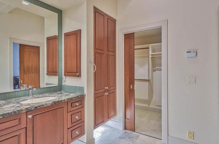 Primary bathroom with attached large walk in closet