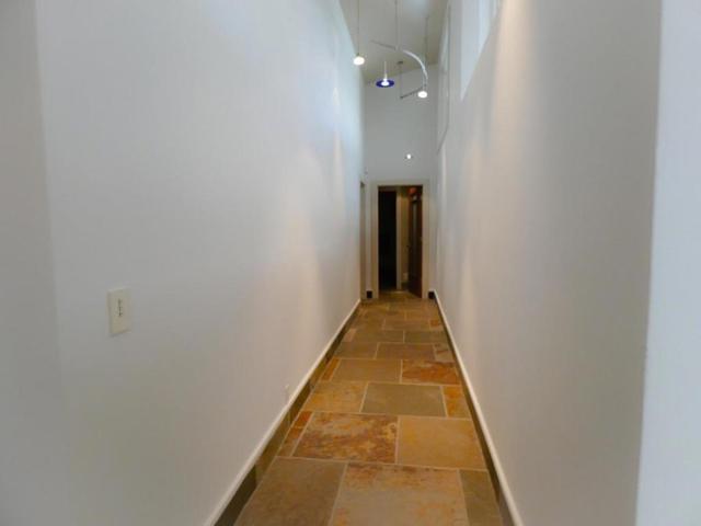 Hallway from Primary to two beds and one bath