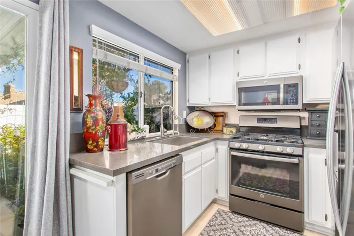 Bottom Kitchen Cabinets have been painted Gray