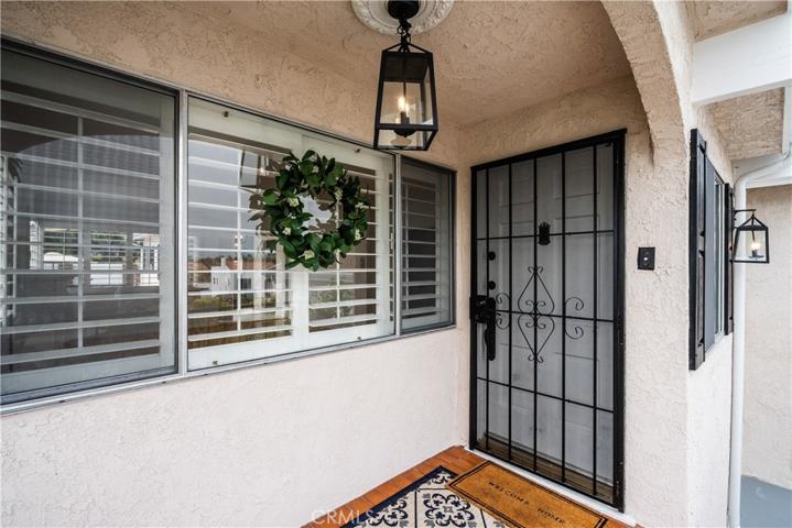 Covered tiled front porch with security door.