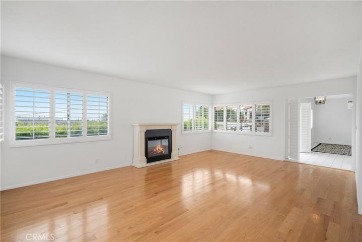 Living room with harbor and patio views. New fireplace with remote