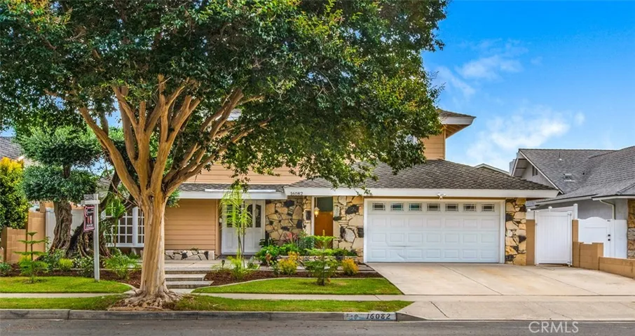 Beautiful front landscaping, double door entry and bay window from Living Room