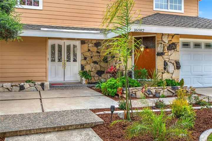 Front patio w/ large pavers and stone garden walls