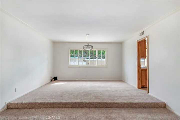 Entry to kitchen off of the dining/living area