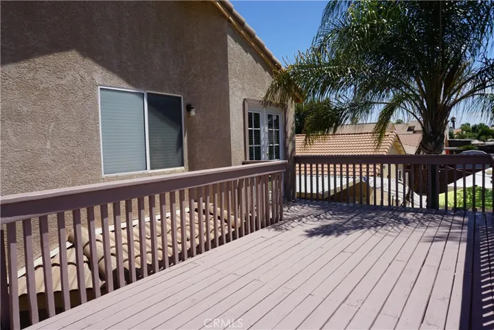 balcony with stairs to yard below