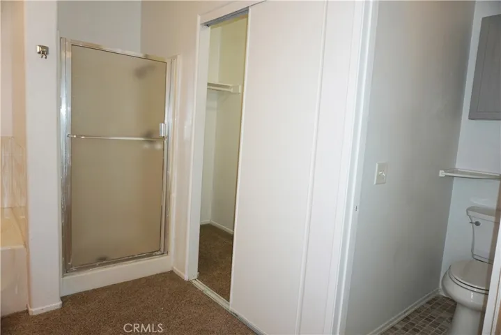 ensuite bathroom with walkin closet