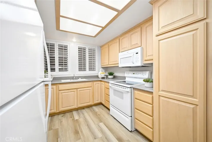 Light and bright with widows over the sink. Spacious pantry.