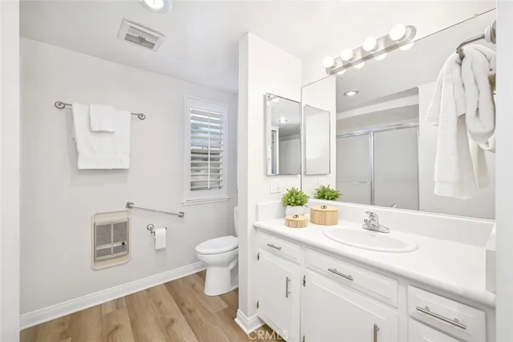 Bright white remodeled bath.