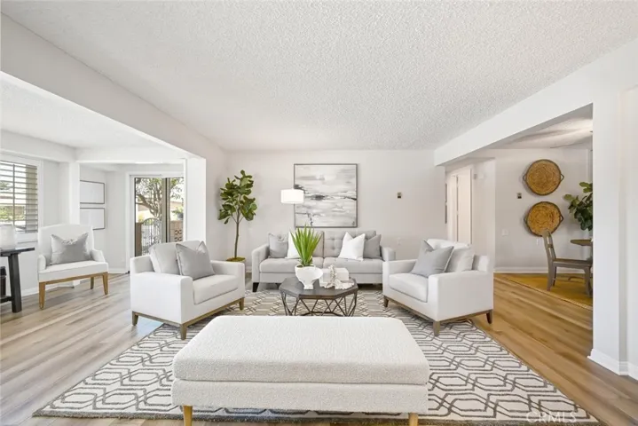 This spacious living room has a sliding door which gives entrance to the patio.