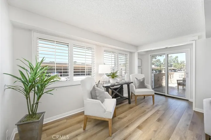 This is the square footage added to the living room. Windows and a sliding door bring light into this thoughtfully designed space. Sliding door leads to the lovely patio which over-looks the lush landscape.