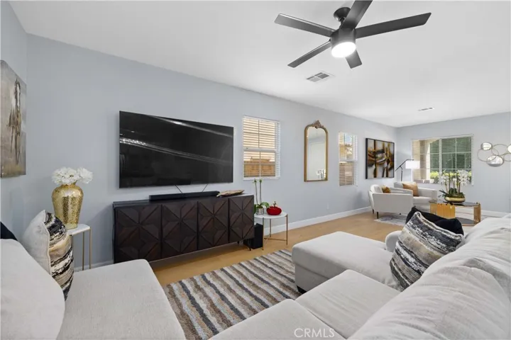 Open floor plan living room with engineered hard wood floors