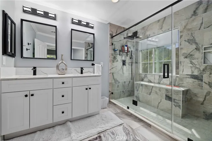 Master bath with double vanity and spacious shower