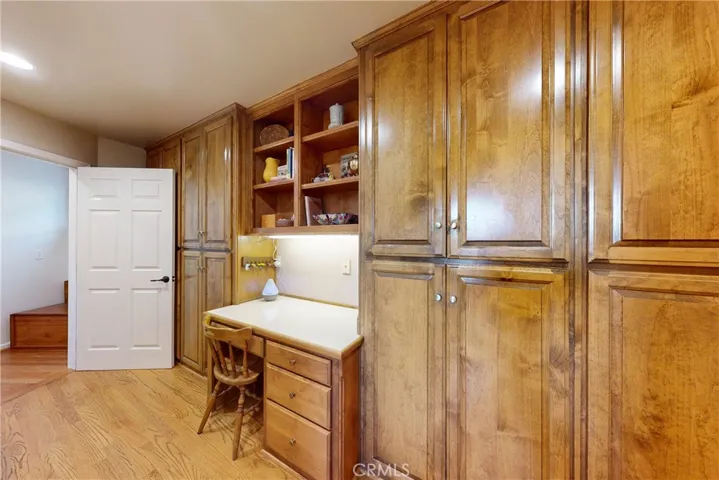 Pantry and desk located adjacent to the kitchen