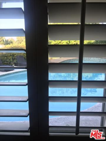 Plantation shutters in bedroom