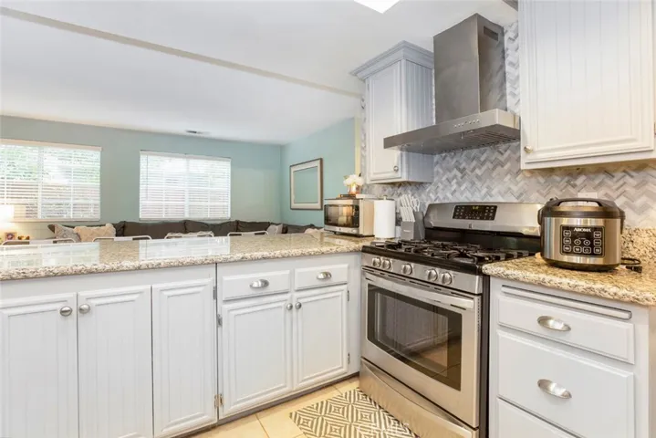Kitchen Gas range & lots of cabinets.
