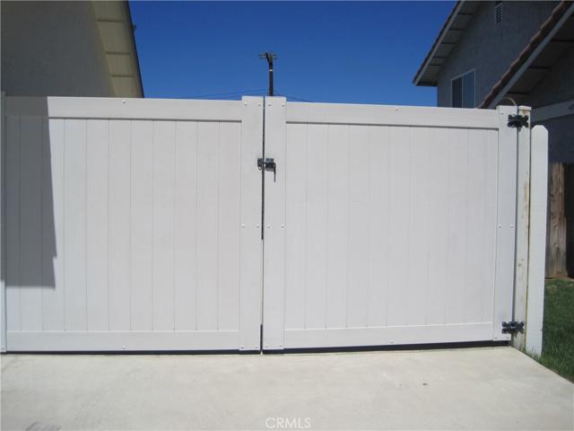 GATED RV PARKING NEXT TO 3 CAR GARAGE