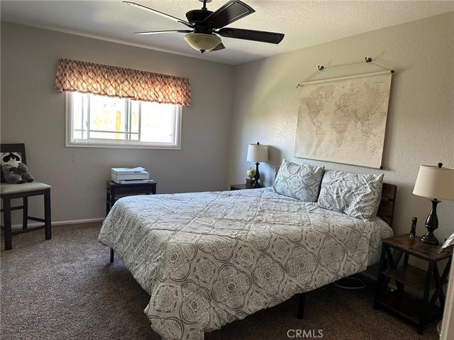 SECOND BEDROOM W/CEILING FAN+MIRRORED CLOSET DOORS