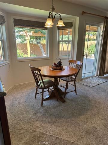 FAMILY ROOM EATING NOOK OVERLOOKING LUSH BACKYARD