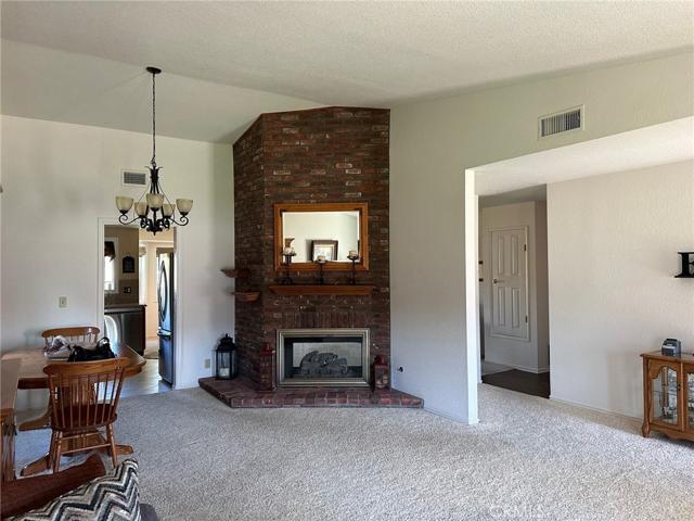 LIVING ROOM/DINING ROOM W/BRICK FIREPLACE