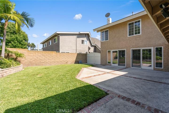 Lush landscaping and a patio perfect for entertaining or enjoying year round sunshine and ocean breezes!
