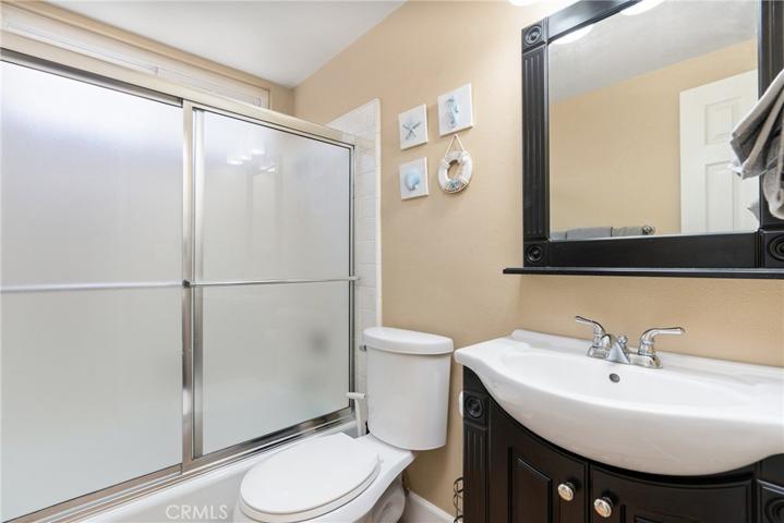 Full downstairs bathroom with a shower/tub and direct access to the attached 3-car garage!