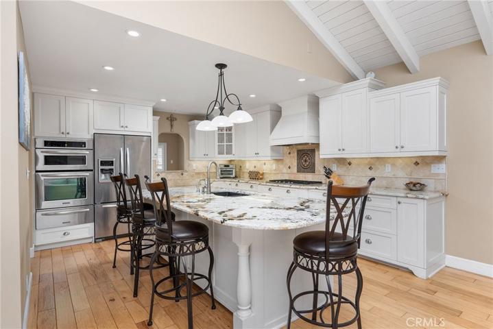 The layout flows seamlessly into a beautiful, remodeled kitchen!